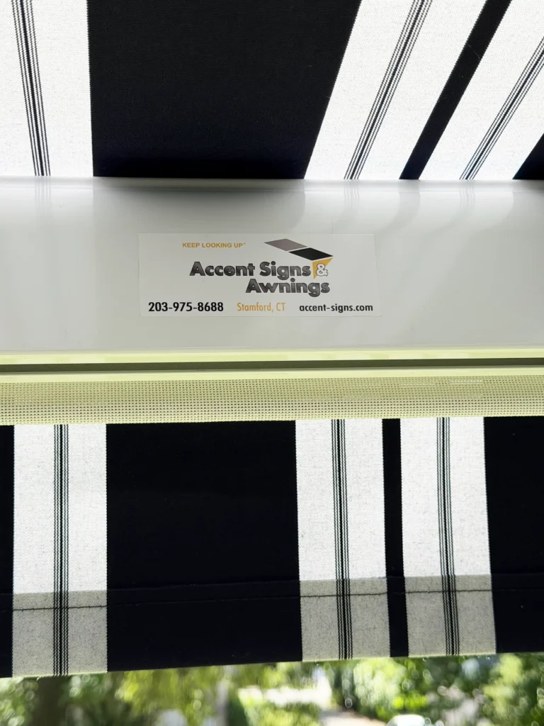 Advertisement card for Accent Signs & Awnings showing phone number and Stamford, CT location